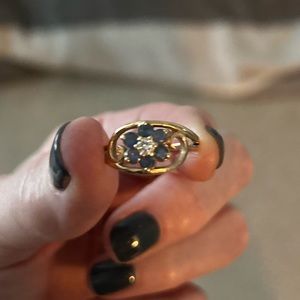 Gold ring with blue flower